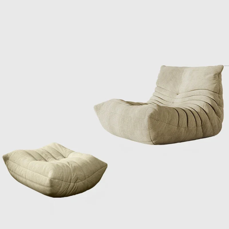 Chauffeuse basse en velours côtelé beige avec repose-pieds