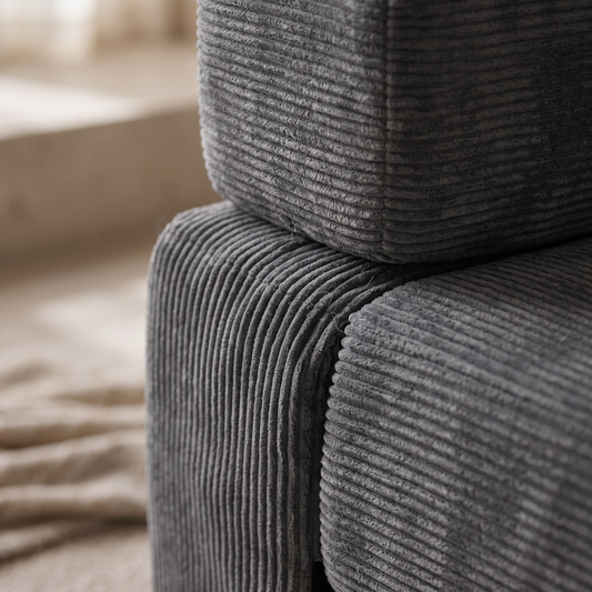 Gros plan sur le velours côtelé et la pliure du fauteuil convertible 4 en 1